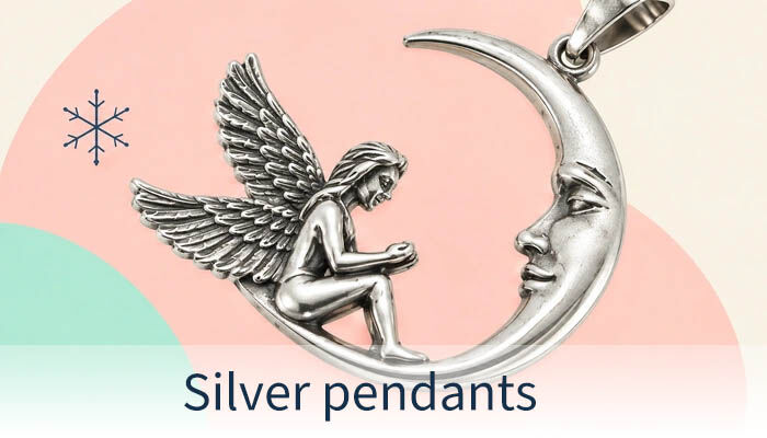 Silver pendant featuring a seated angel inside a crescent moon.