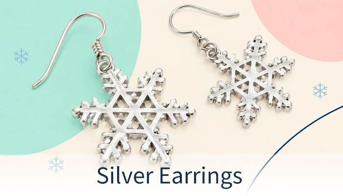 Silver drop earrings with openwork snowflake designs.