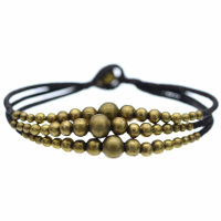 Faux leather bracelet with bronze beads