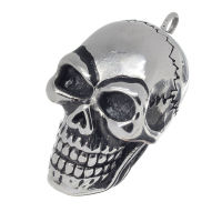 Stainless steel pendant - Laughing skull with heavy skull fracture